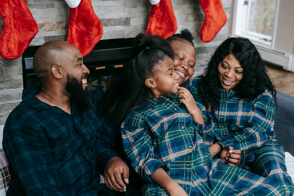 High angle of delighted African American family enjoying pleasant time together during Christmas Eve