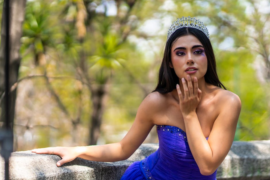 A beautiful Latina woman in a purple princess outfit poses outdoors in Ciudad de México.