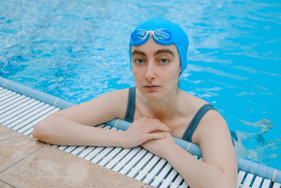 Swimmer wearing a swim cap to protect hair from chlorine